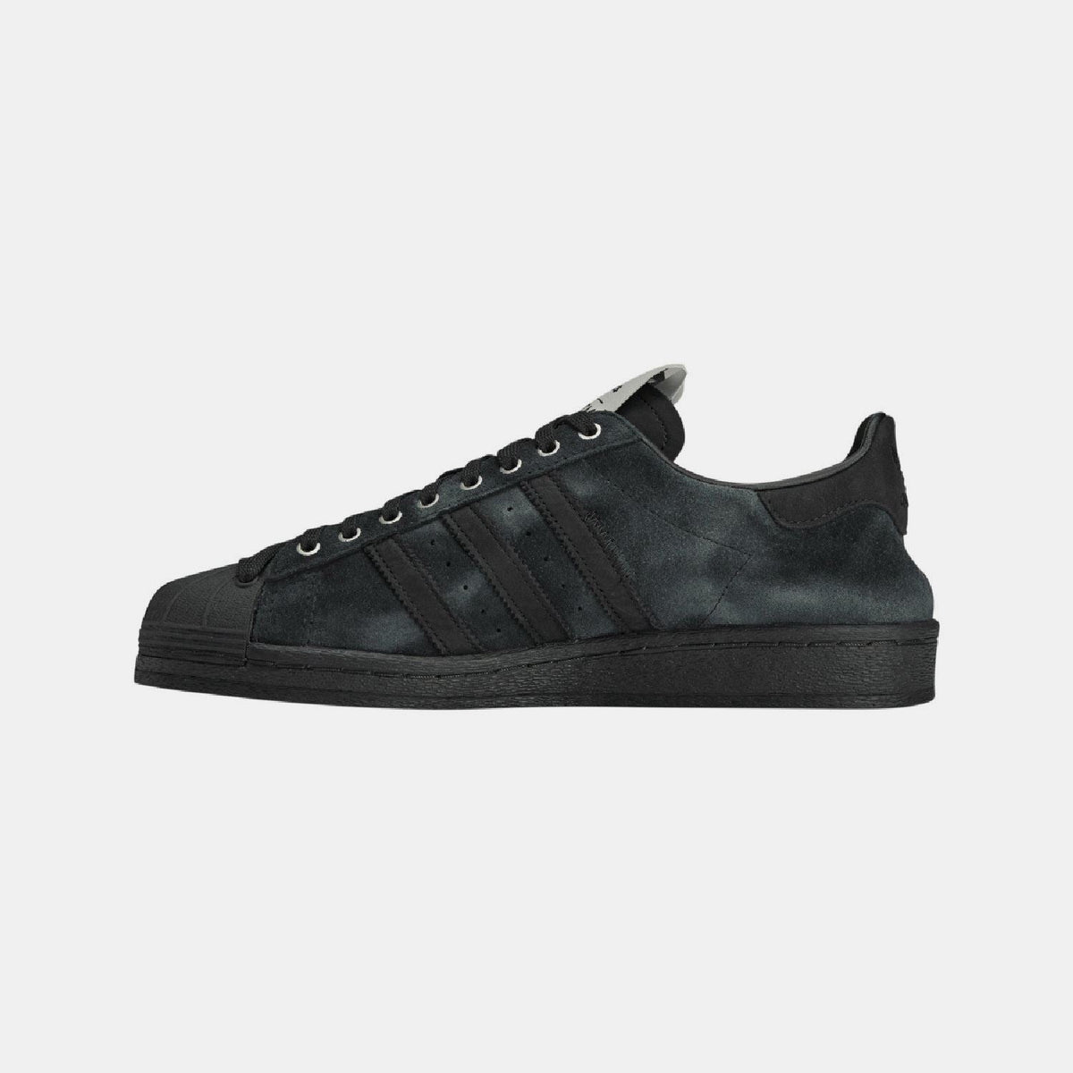 adidas Originals SFTM Superstar 82 trainers in white and black leather with iconic shell toe and classic design.