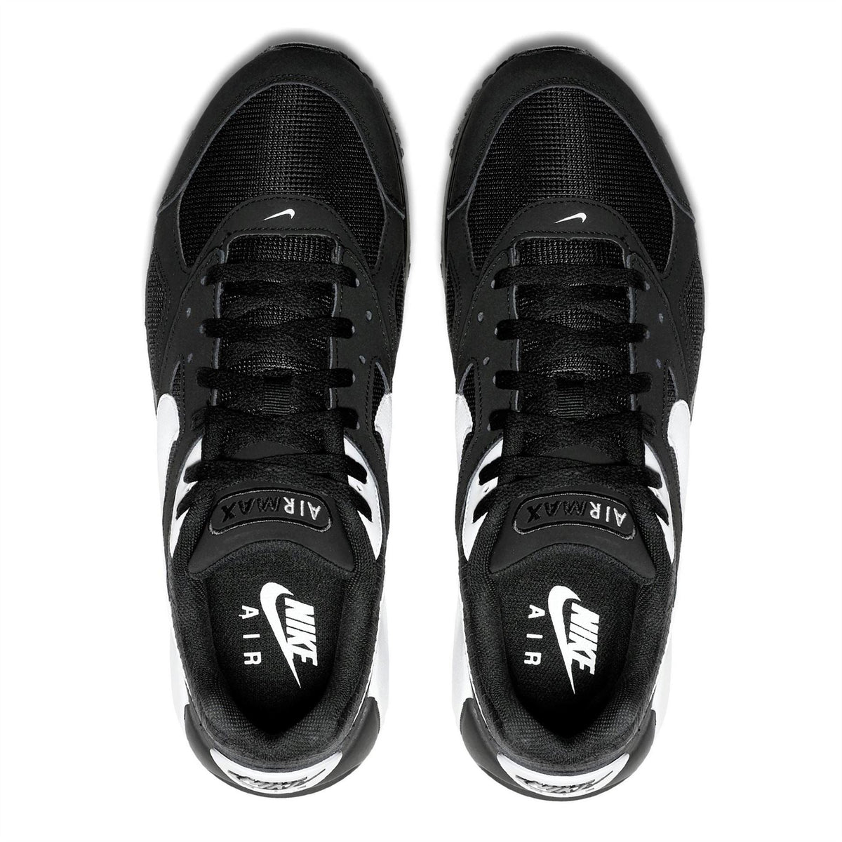 Black lace-up trainers with Nike Air label on insoles and textured upper
