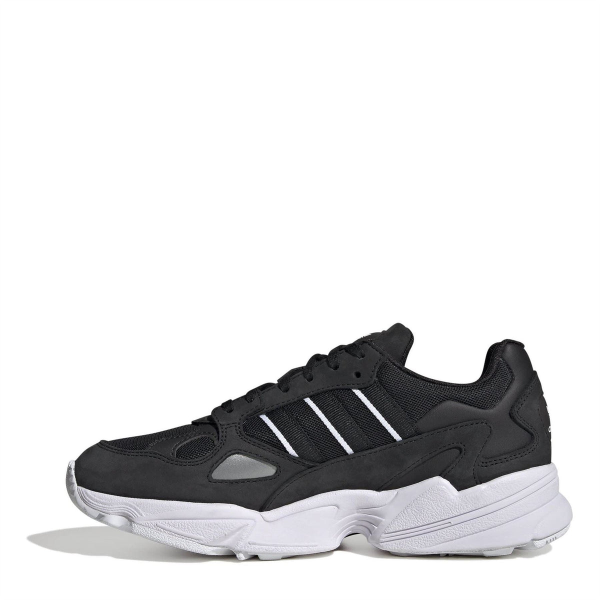 Black low-top lace-up sneakers with white stripes, mesh-look panels, and white sole