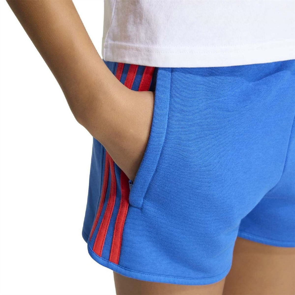 Blue juniors shorts close-up showing front pocket and red side stripe trim