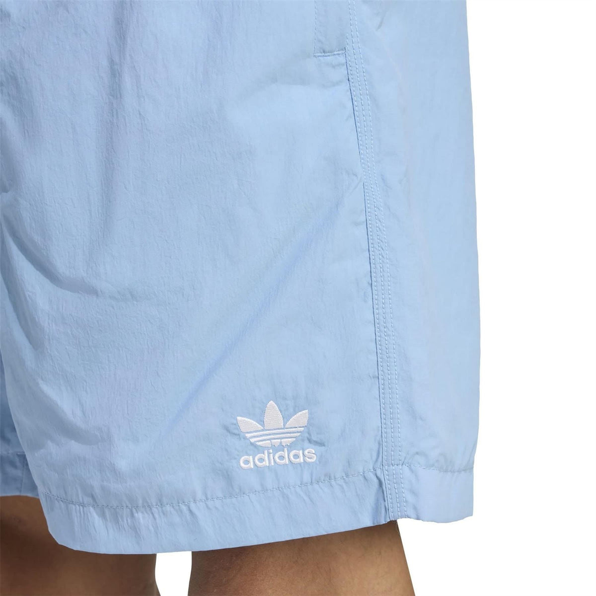 Light blue shorts hem with embroidered adidas logo and elastic waistband