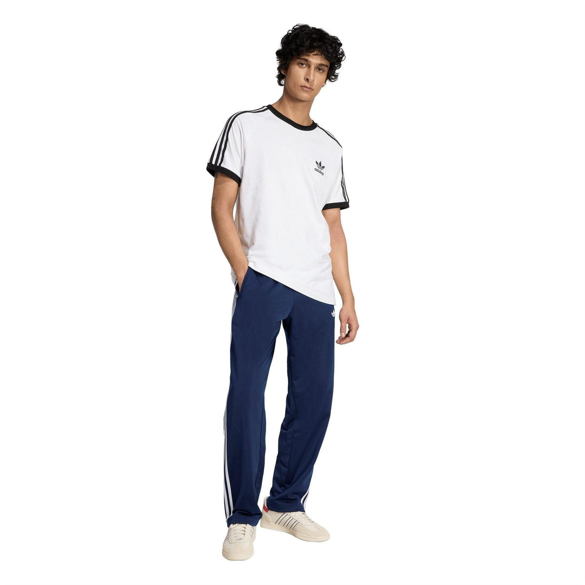 Men's navy track joggers with white 3-stripe detailing and relaxed fit