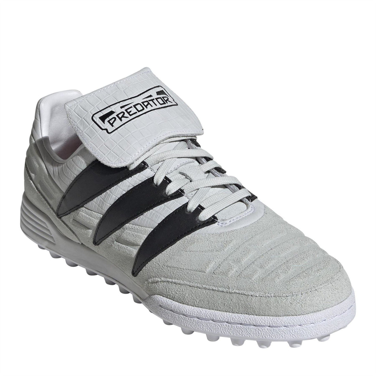 Low-top soccer cleat in light gray with black stripes, white laces, and Predator logo strap