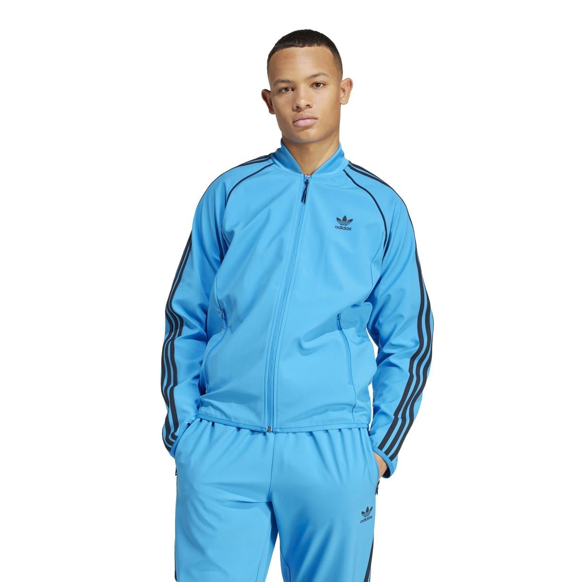 Blue adidas track jacket with full zip, high collar, and black triple stripe sleeves