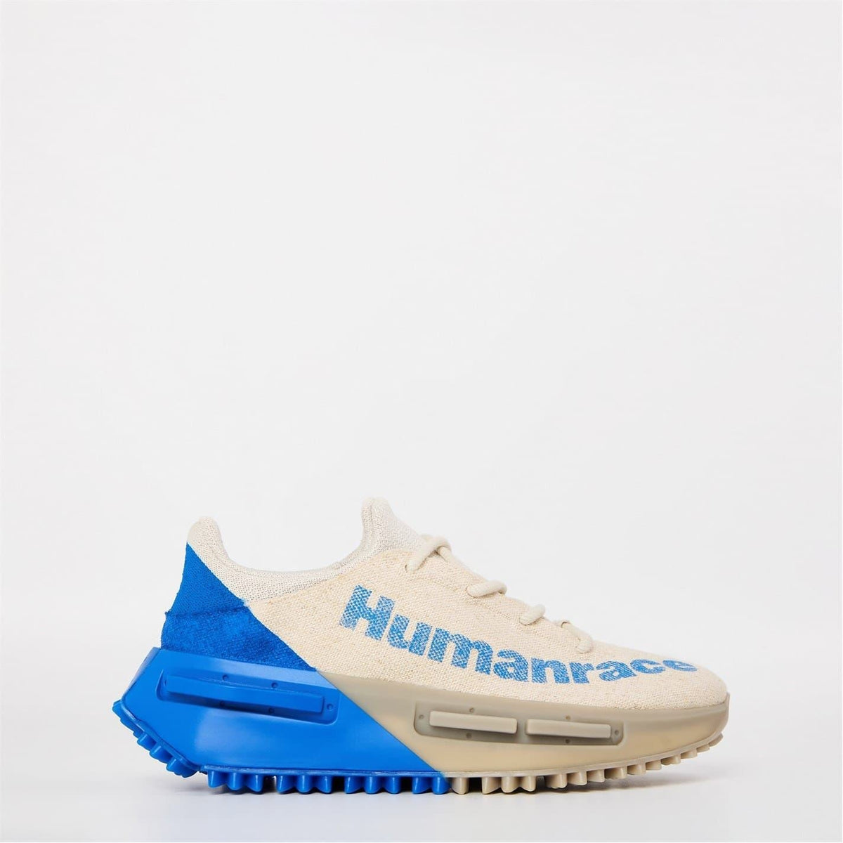Beige and blue lace-up sneakers with Humanrace lettering, chunky NMD sole unit
