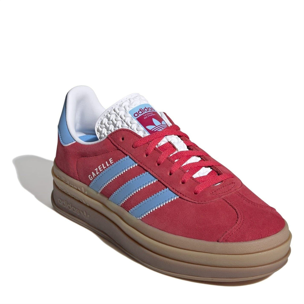 Red Gazelle low-top sneakers with white knit collar, light blue stripes, tan gum sole