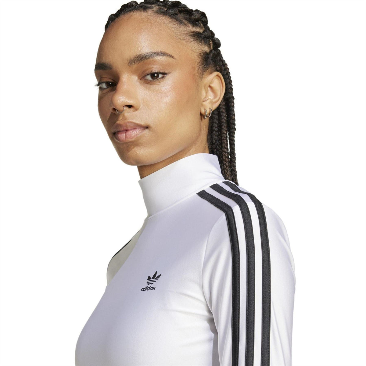 White mock neck T-shirt close-up with black triple-stripe shoulder detail