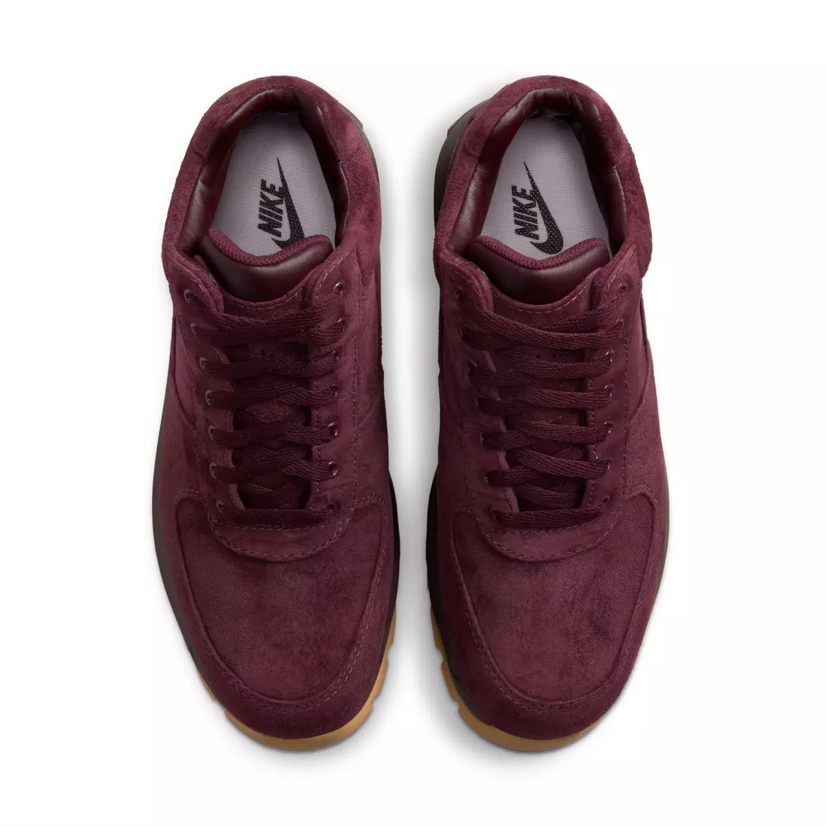 Burgundy suede lace-up sneakers with Nike logo on tongue and gum sole