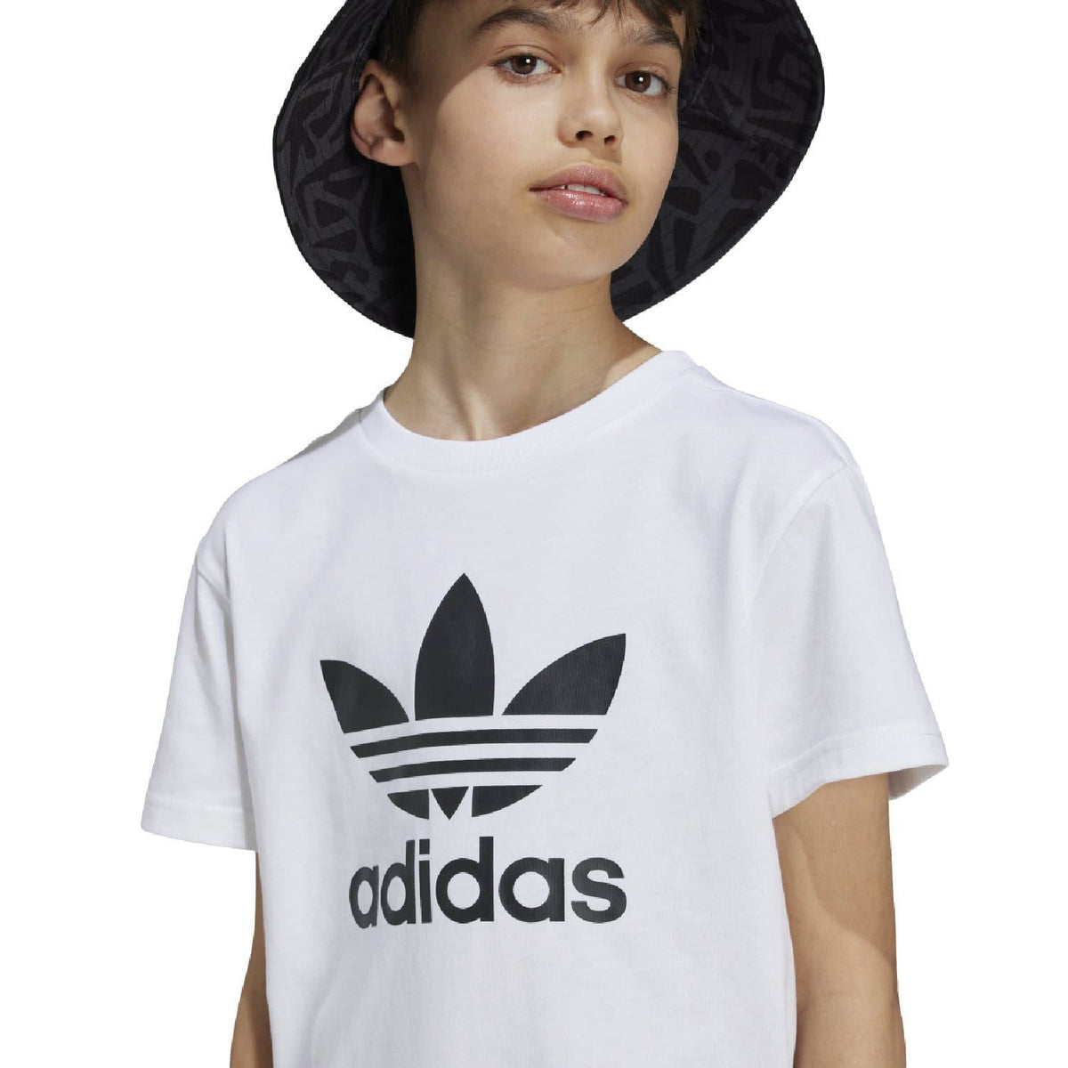 White junior t-shirt close-up with black adidas Trefoil logo print at center chest