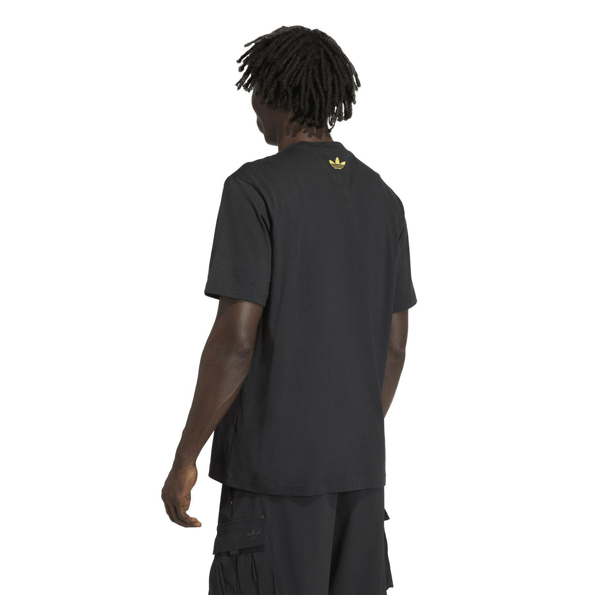 Black crew-neck T-shirt with small yellow adidas trefoil on back