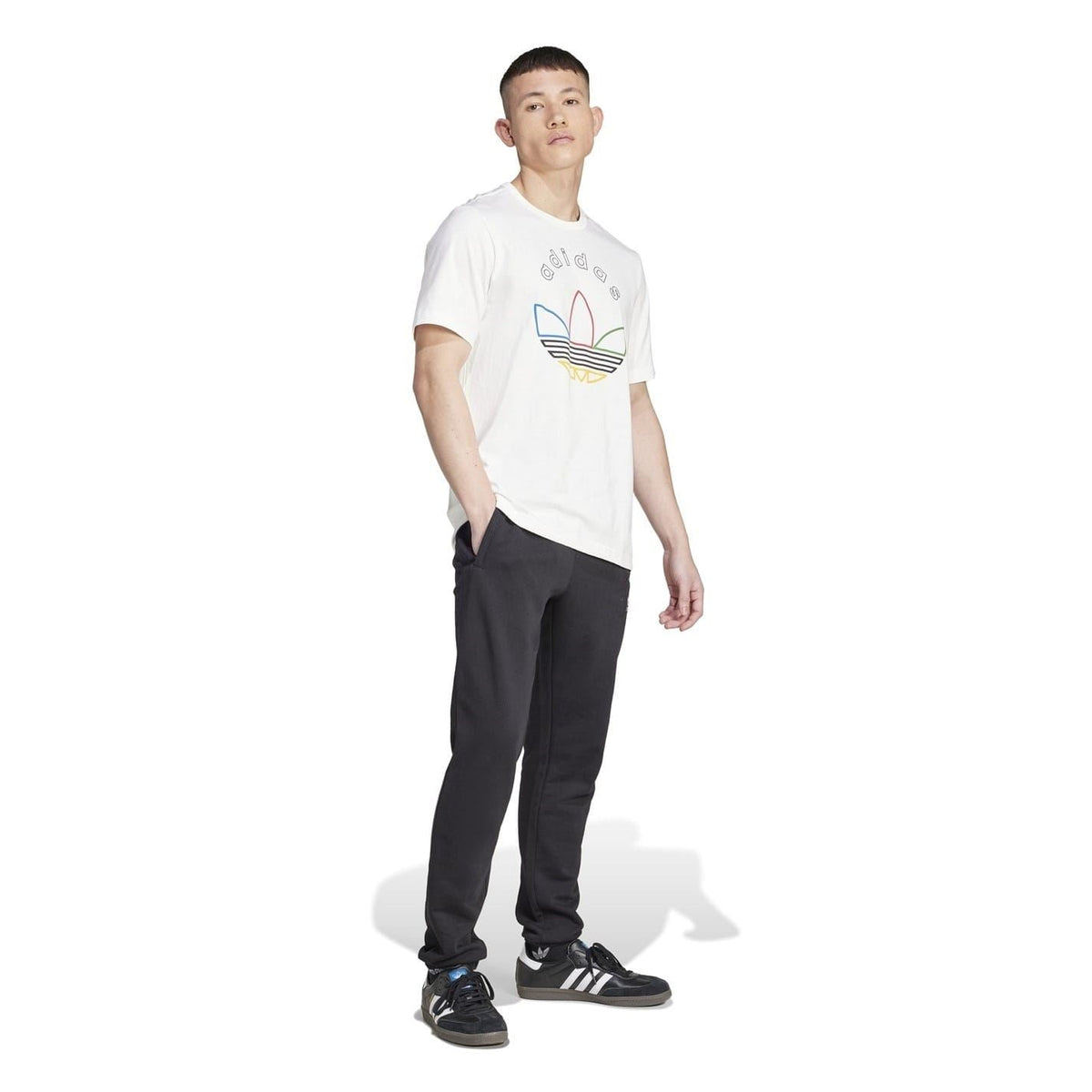 Black joggers worn by model; elastic waistband, tapered fit, adidas logo on leg