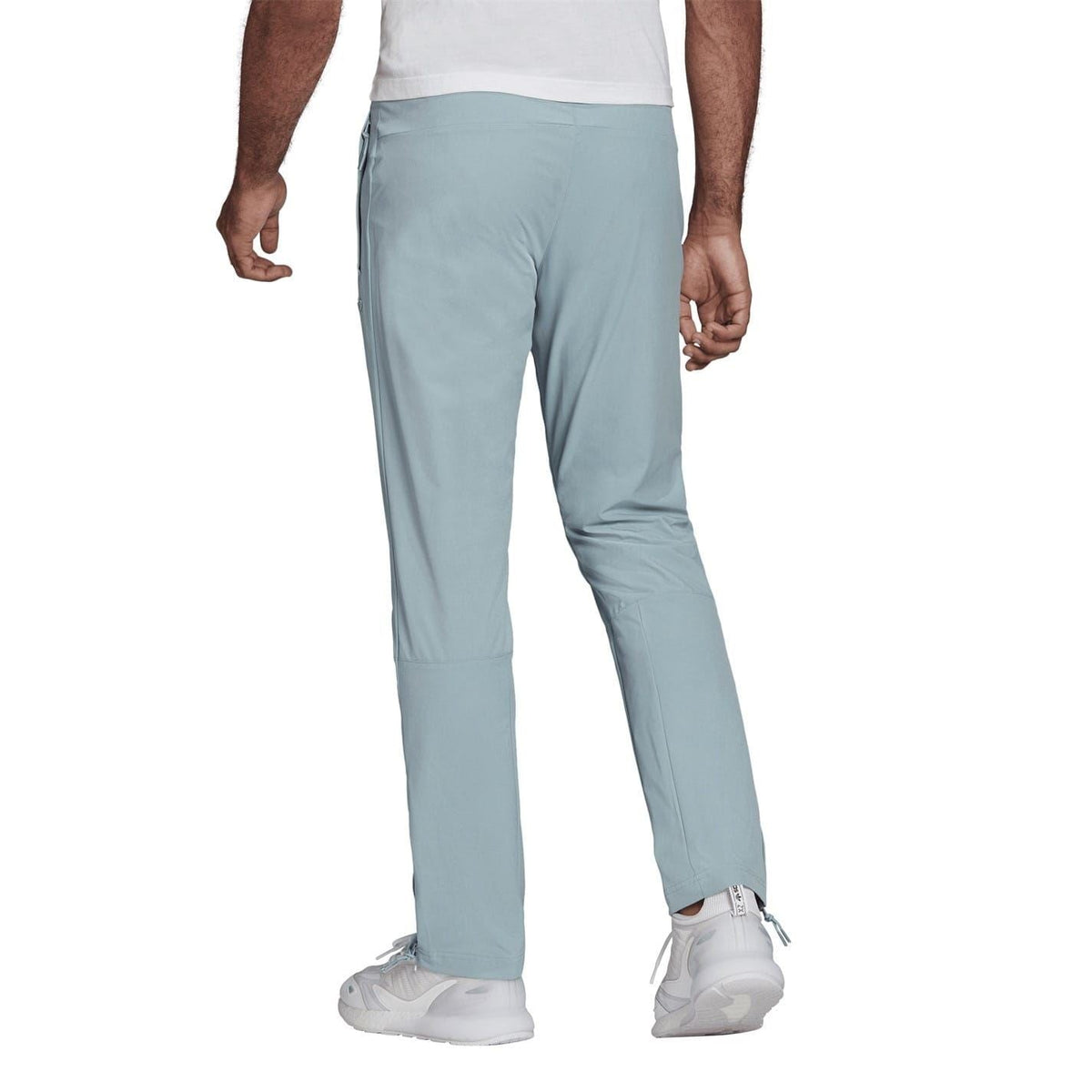 Light blue jogger pants with elastic waist and drawstring, tapered legs, ankle cuffs.