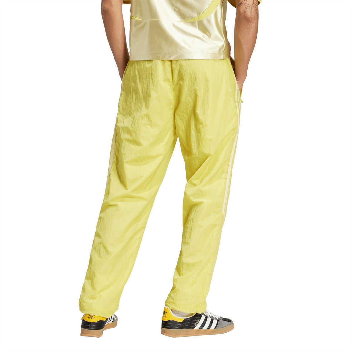 adidas Originals yellow track jogger pants with cuffed hems and side stripe logos