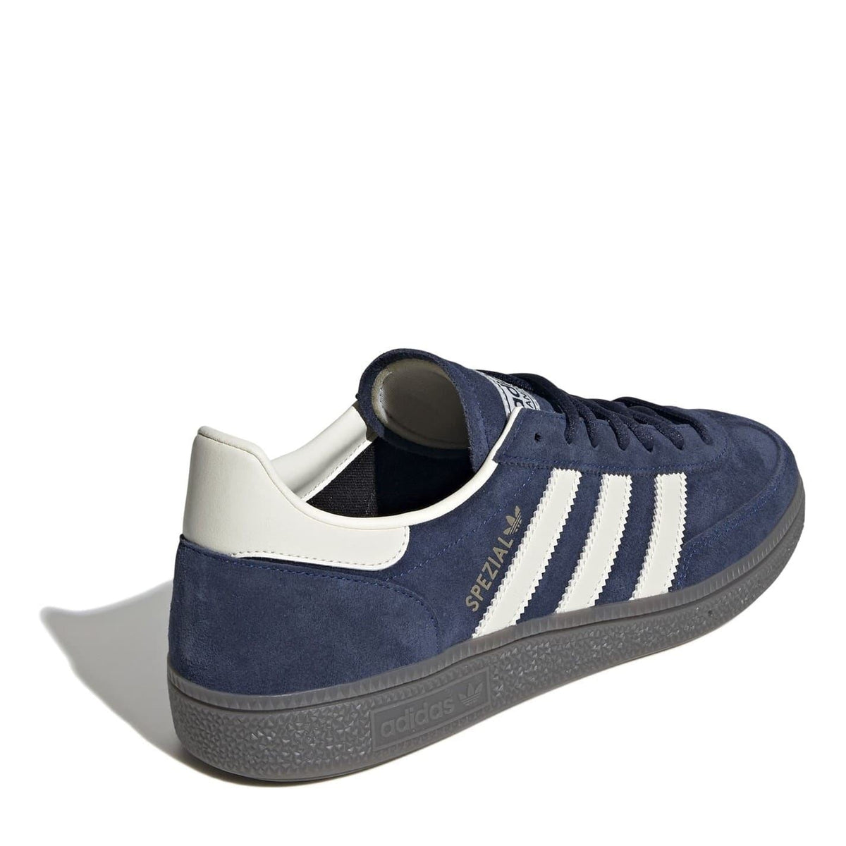 Navy suede low top sneakers rear side view with white collar and cushioned heel.