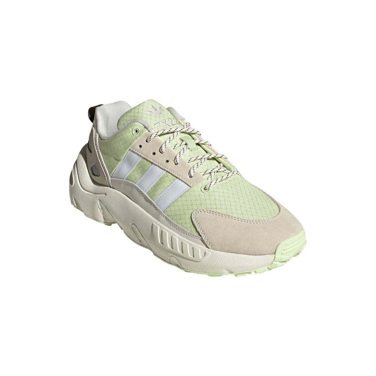 Off white and light green lace-up trainers with suede toe overlays and molded heel tab