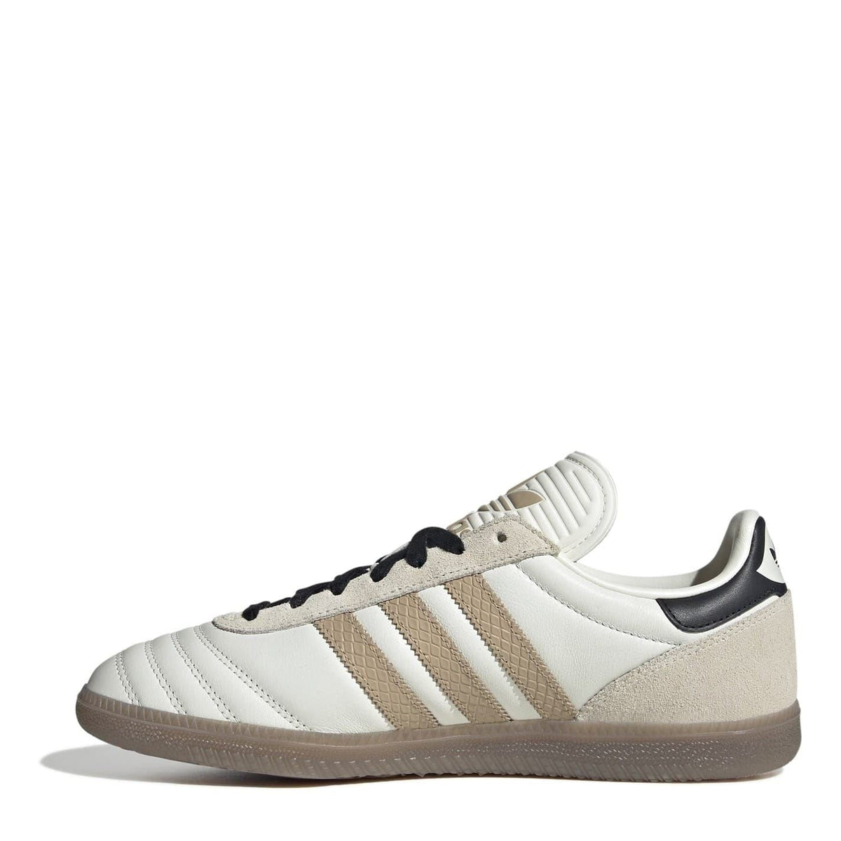 Low-top sneakers in white and beige with black laces, three stripe detailing, and gum sole