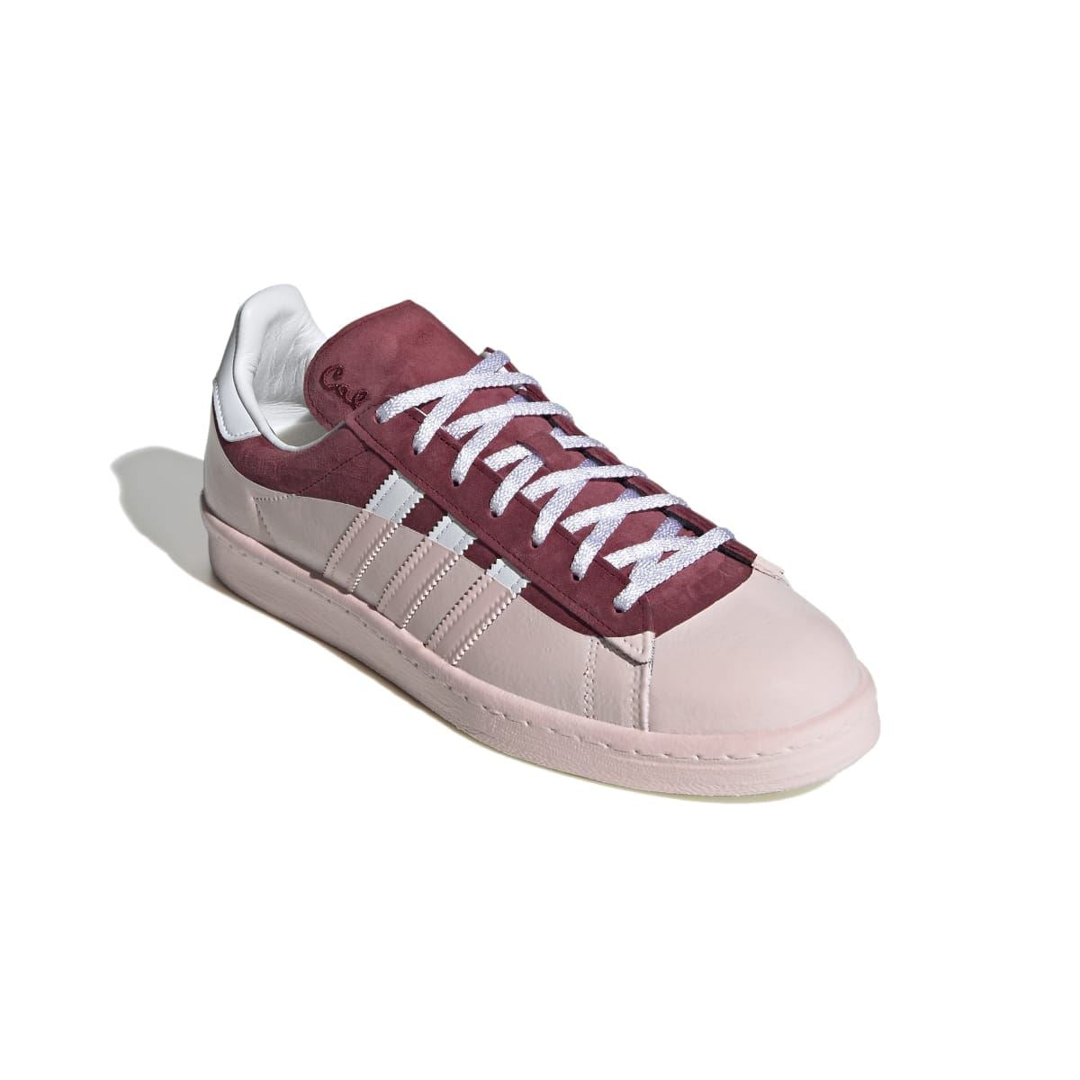 Burgundy suede and off-white low-top trainers with white stripes and patterned lace-up