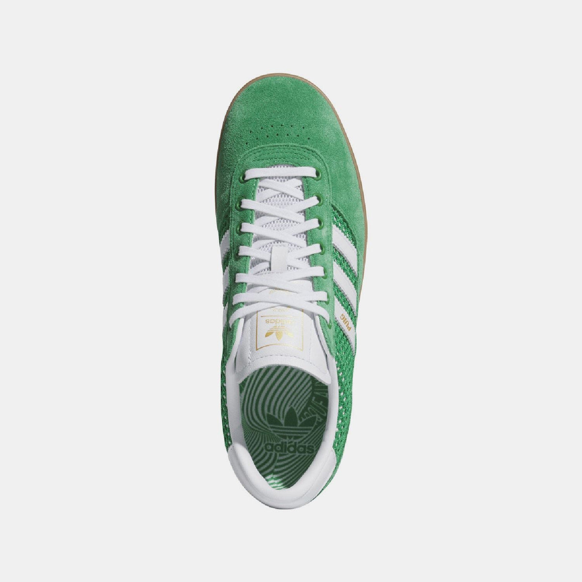 Green adidas indoor trainer viewed from top, with white laces and stripes