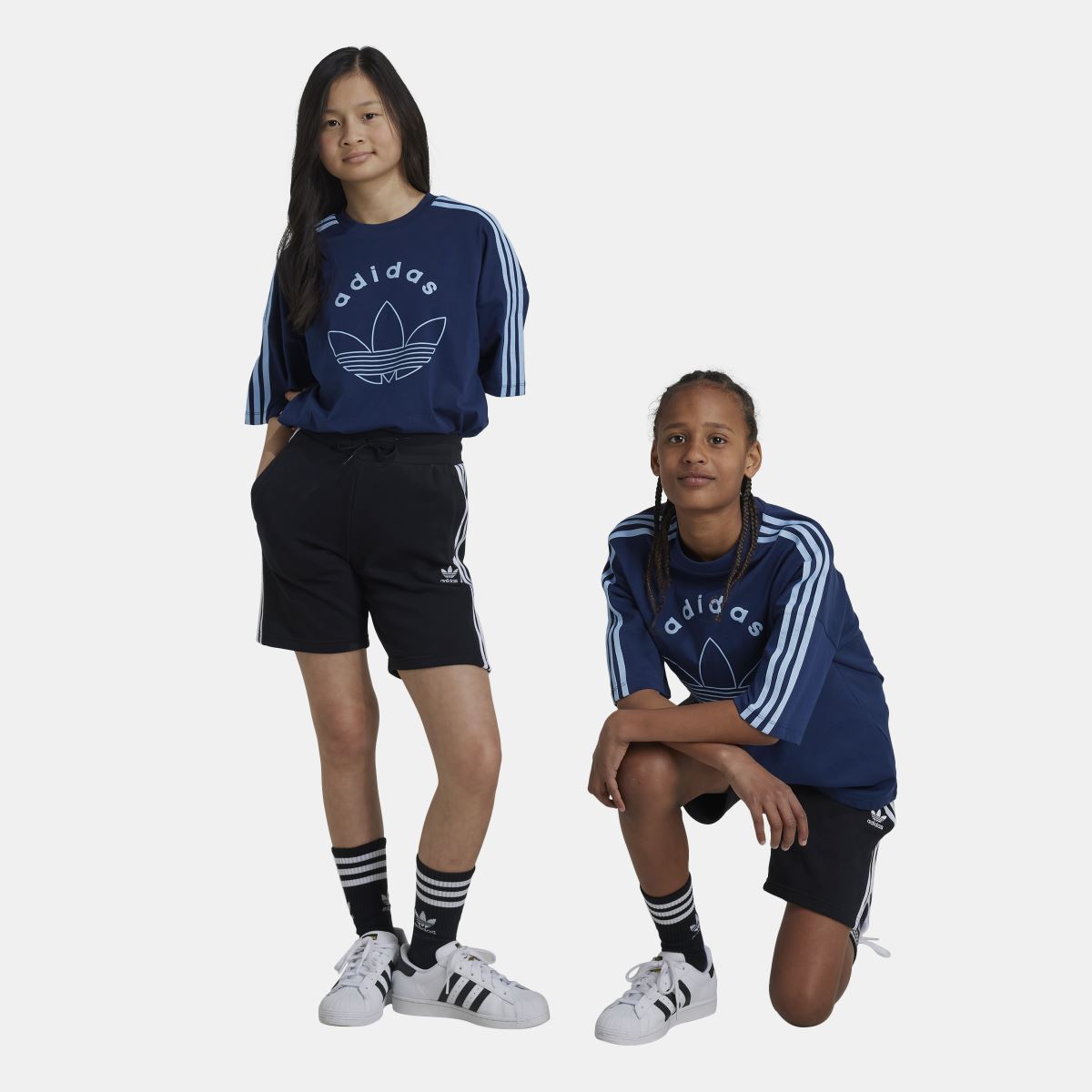 Junior adidas Originals Adicolor shorts in vibrant color, perfect for kids aged 8-16, featuring comfortable fabric and stylish design.