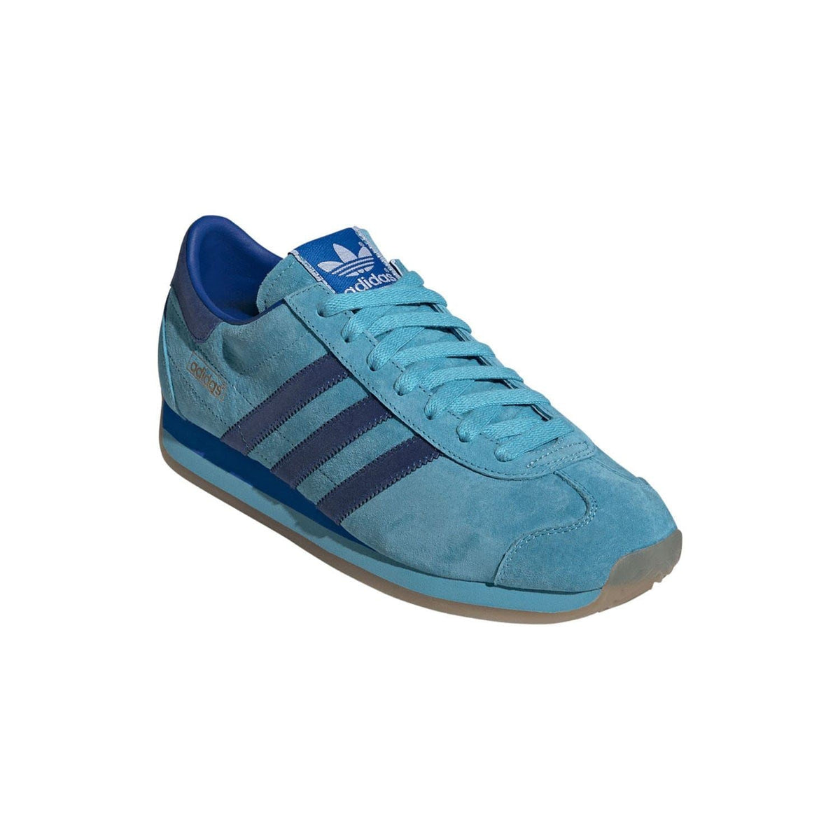 Blue adidas Originals Country Japan trainers, side profile with dark three stripes