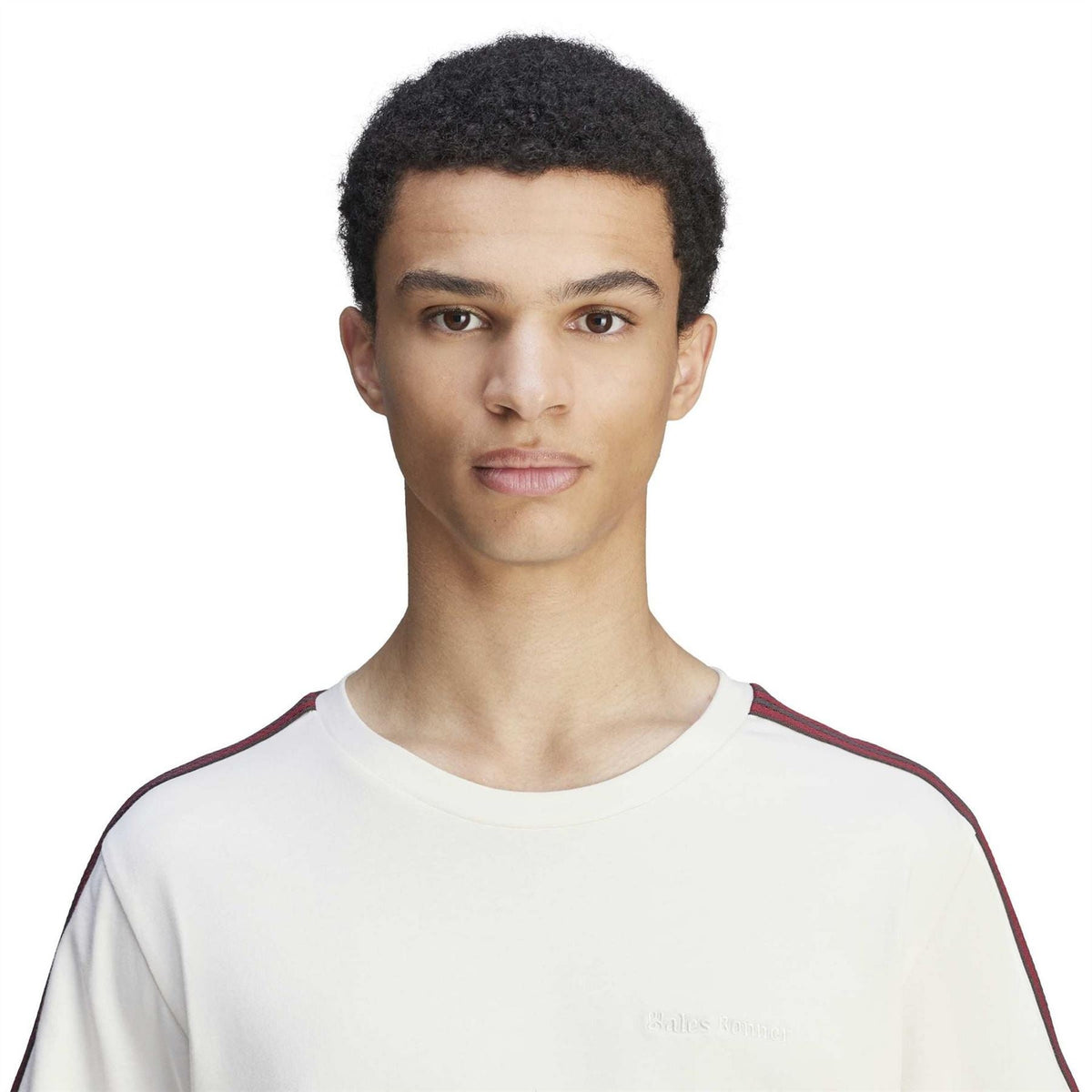 Chalk white crew-neck T-shirt with red-and-black shoulder stripe and small chest logo