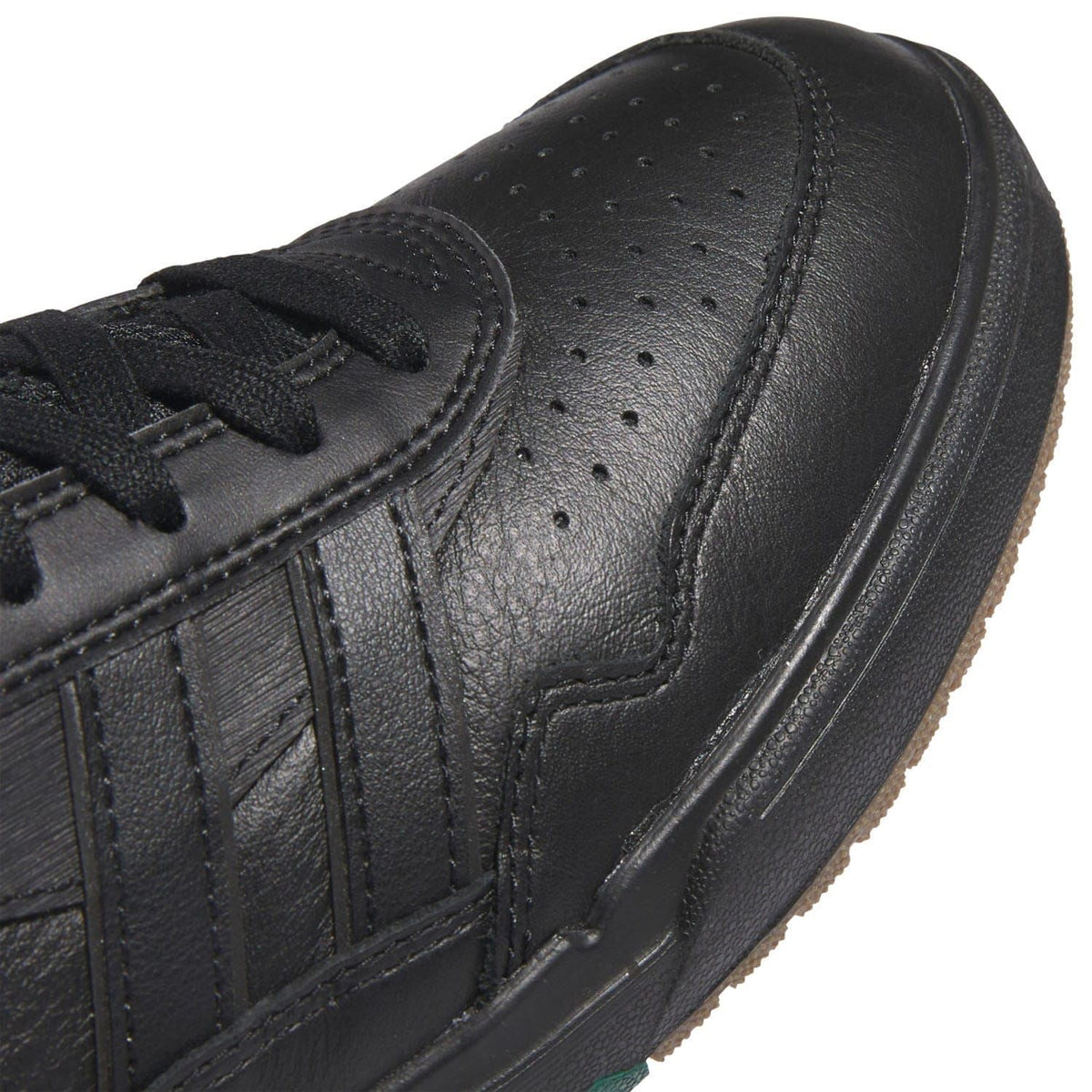 Black Tyshawn II leather upper detail with stitched stripes and perforations