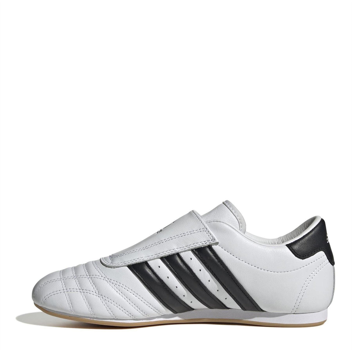 White and black low-top trainers with three black stripes and strap