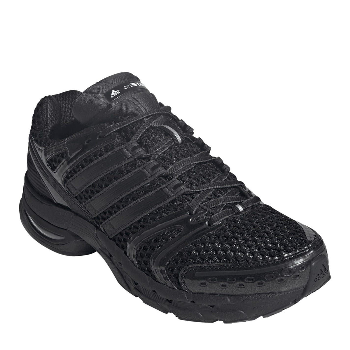 Black textured lace-up sneaker with cushioned collar and patterned toe
