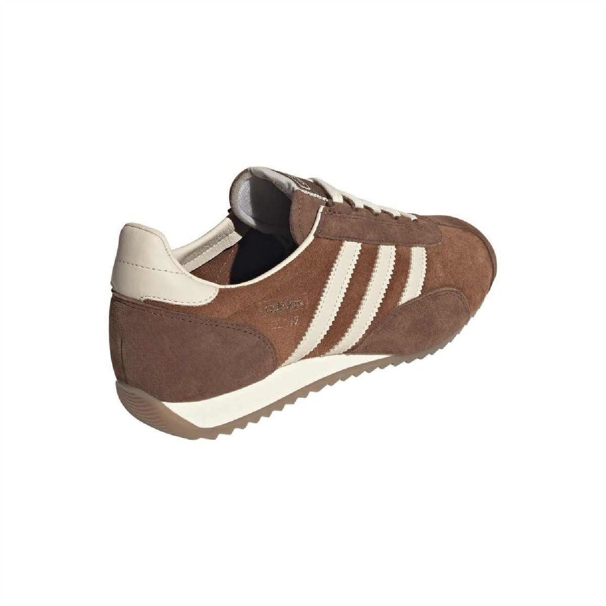 Brown suede trainers heel and side view with white stripes and cushioned collar.