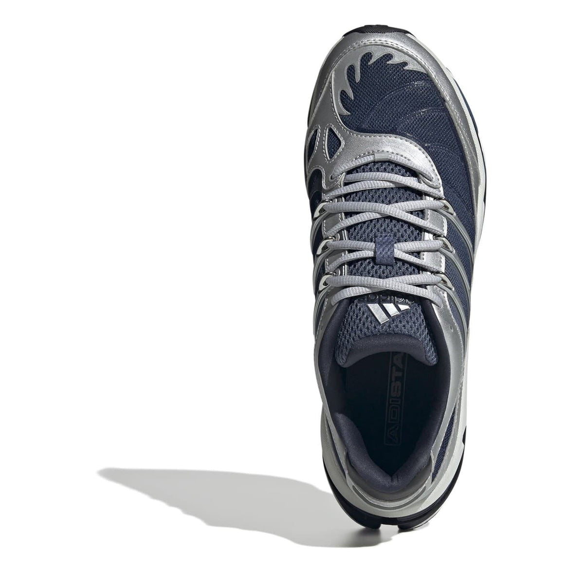 Navy blue and silver low-top sneaker with lace-up front and cushioned tongue