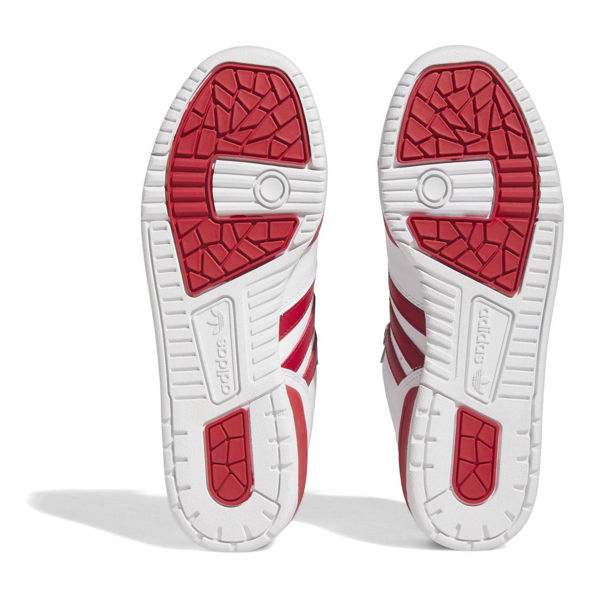 Treaded outsole view of adidas Originals Rivalry low-top trainers in white with red details
