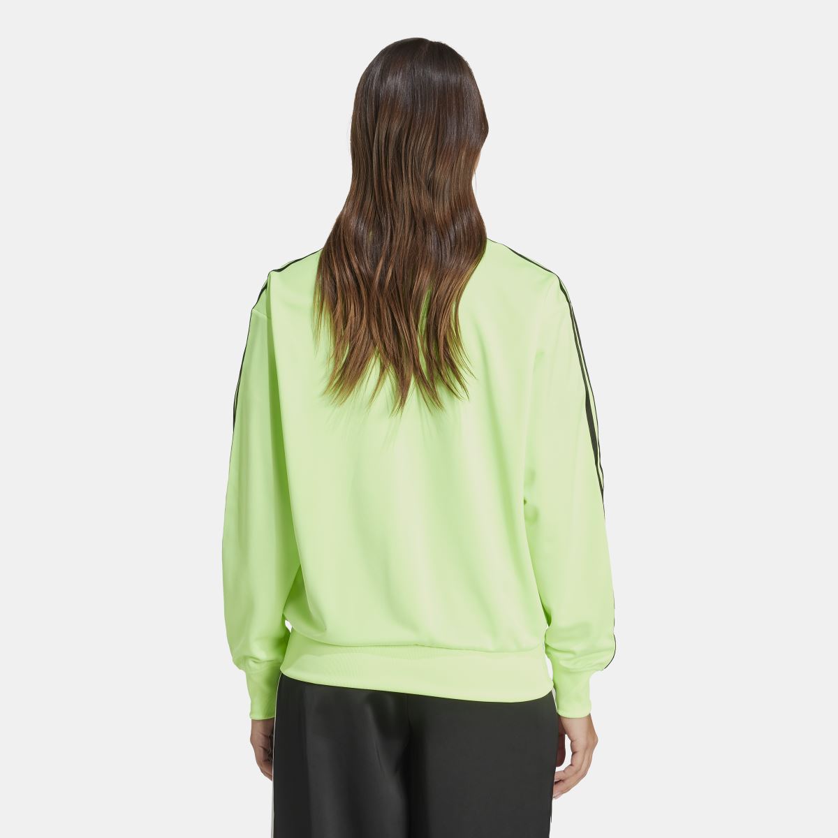 Back view of lime green zip track jacket with trefoil logo and ribbed cuffs