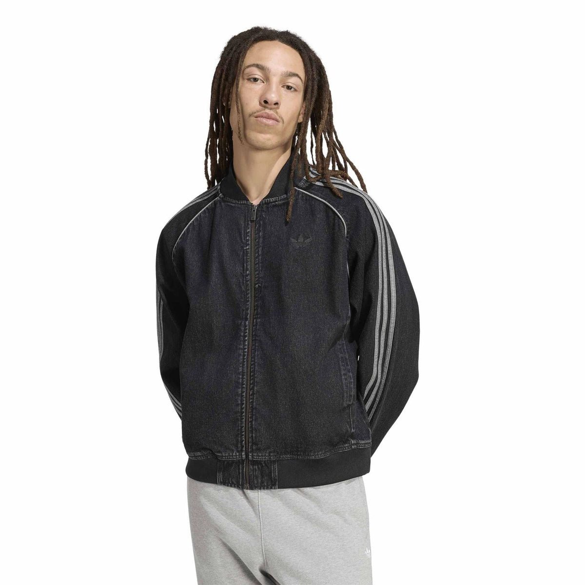 Black denim bomber jacket with ribbed cuffs, three-stripe sleeves, and full-zip front.