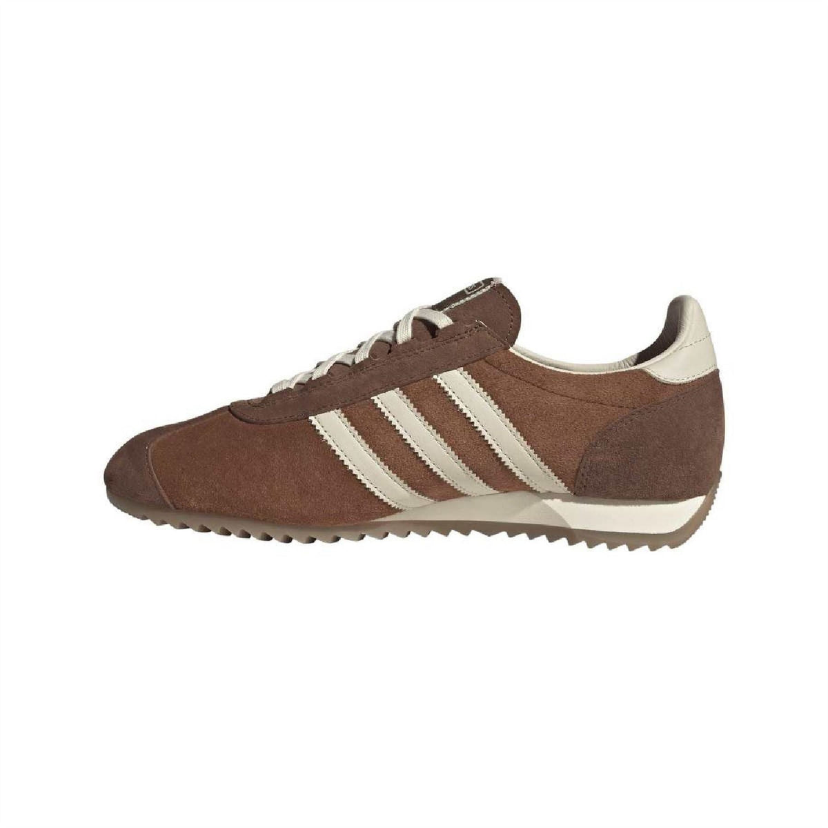 Brown suede low-top trainers, side view with white triple stripes and lace-up.