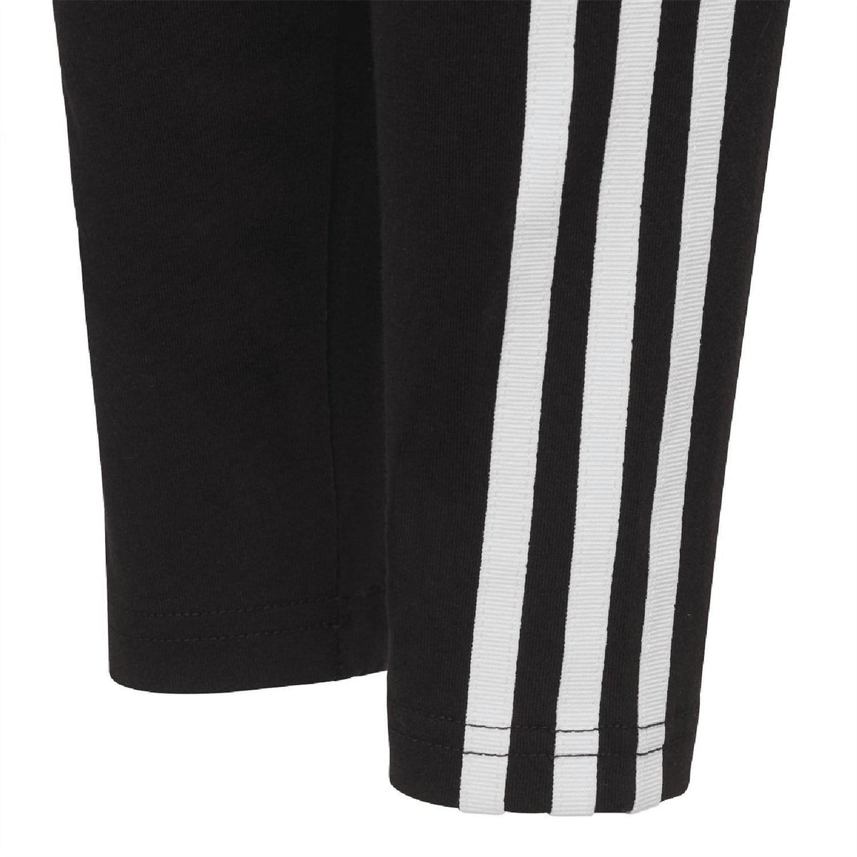 Black leggings with wide white side stripe panels from thigh to hem