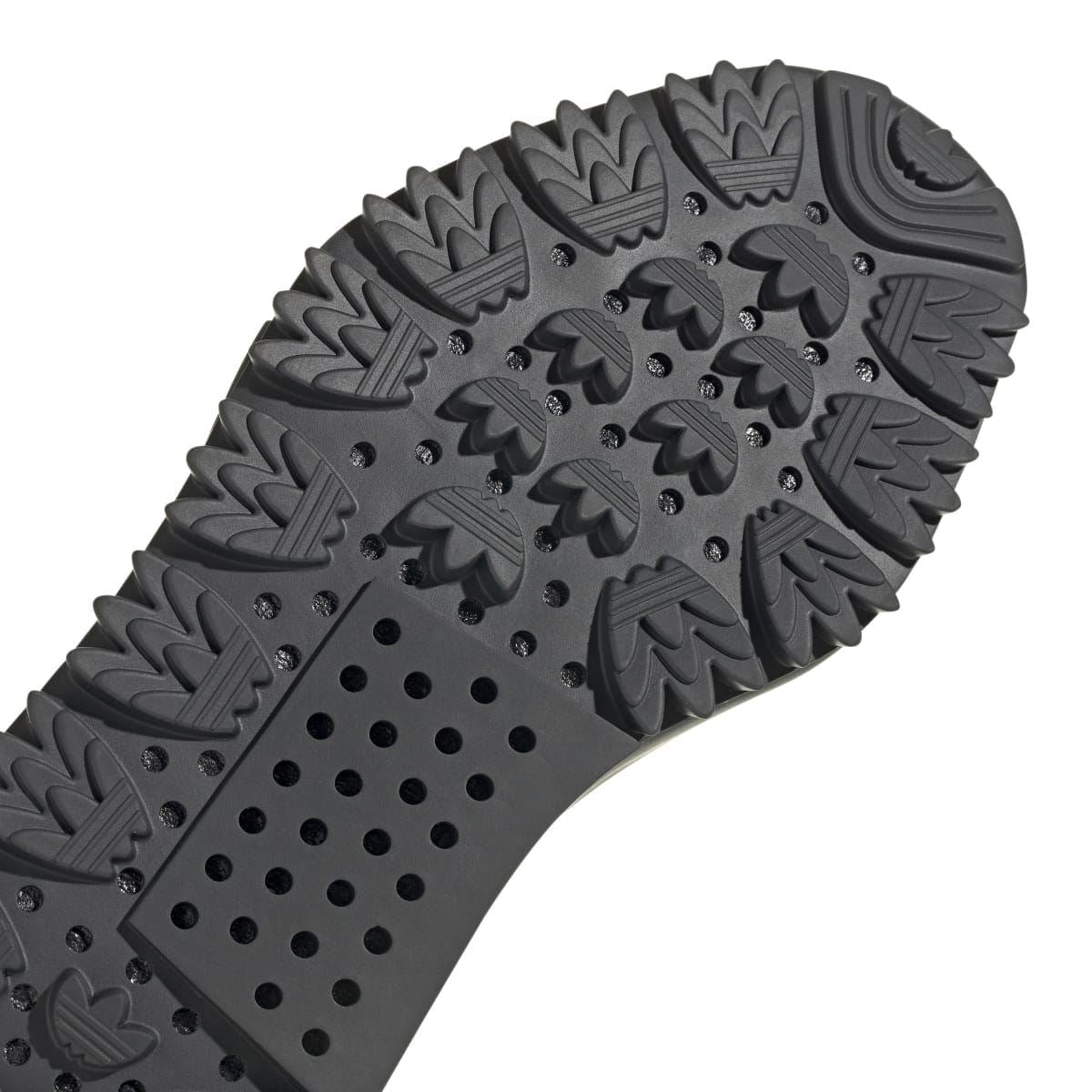adidas NMD_S1 knit trainers outsole close-up with dot and flame-like tread details