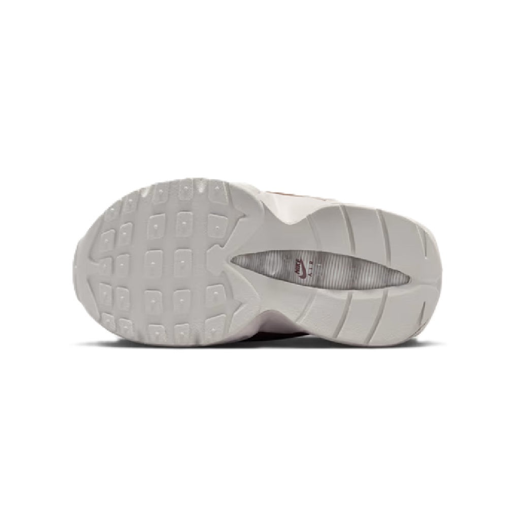 Kids' Nike Air Max 95 sneaker outsole with tread pattern on white rubber sole