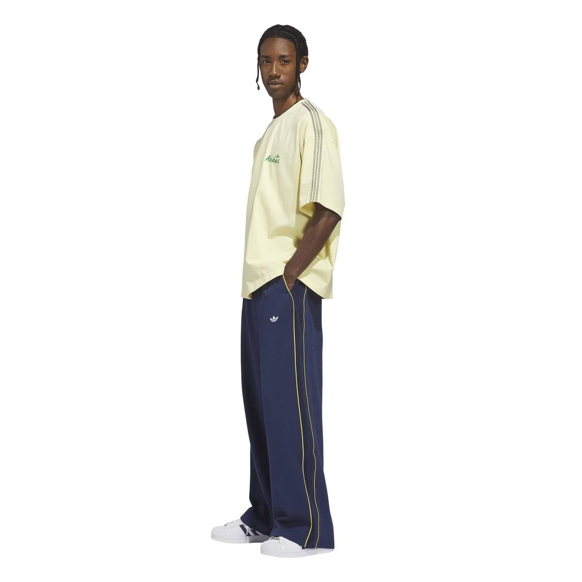 adidas Originals men’s dark blue track pants with yellow piping and elastic waistband