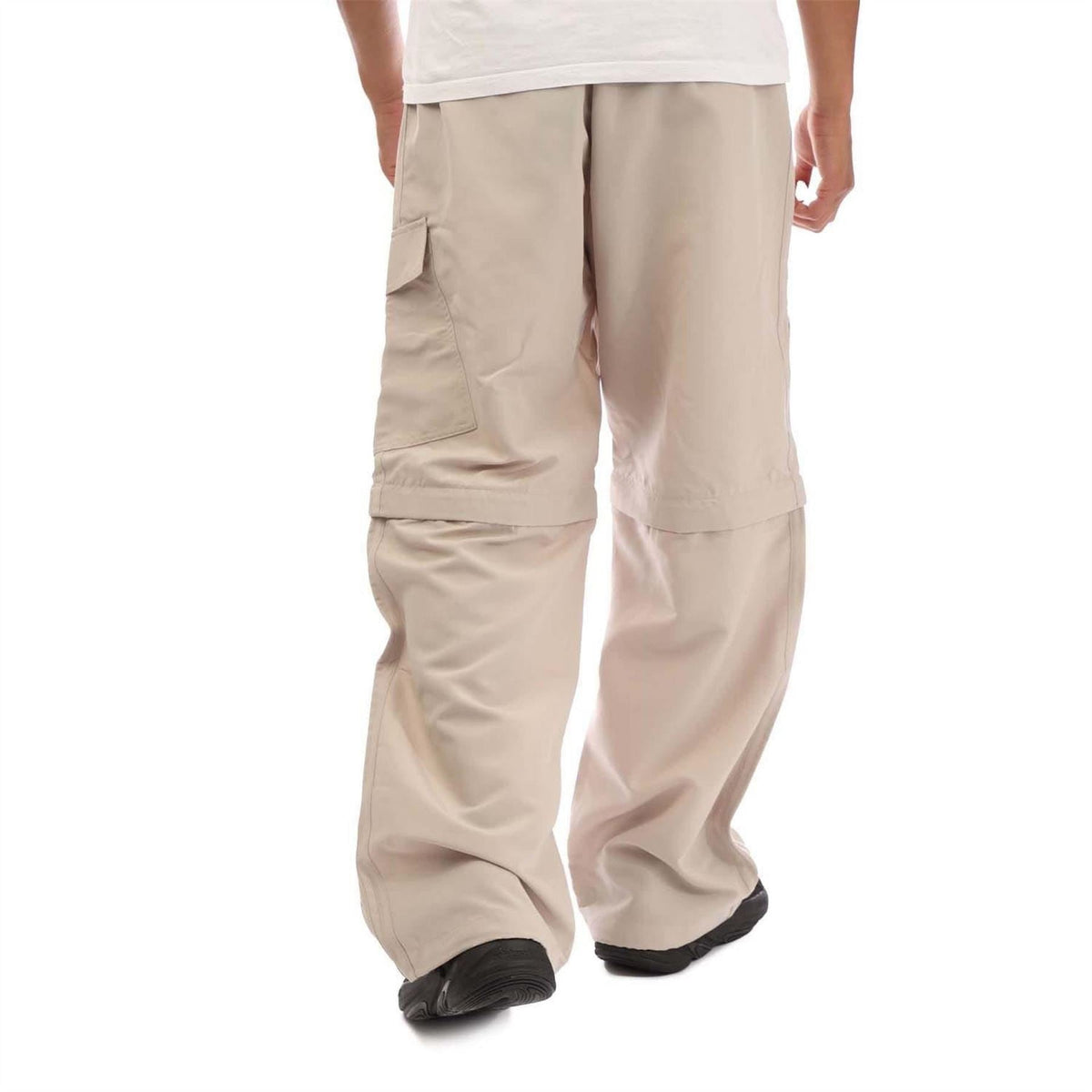 Beige wide-leg jogger pants with utility seams and elastic cuffs