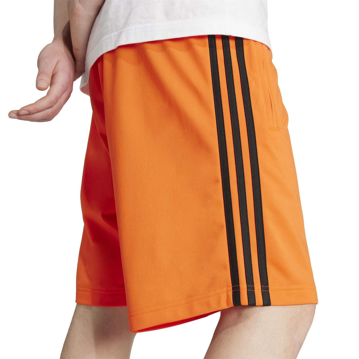 adidas Originals Adicolor Firebird Shorts shown in vibrant red with white stripes, elastic waistband, and sporty design.