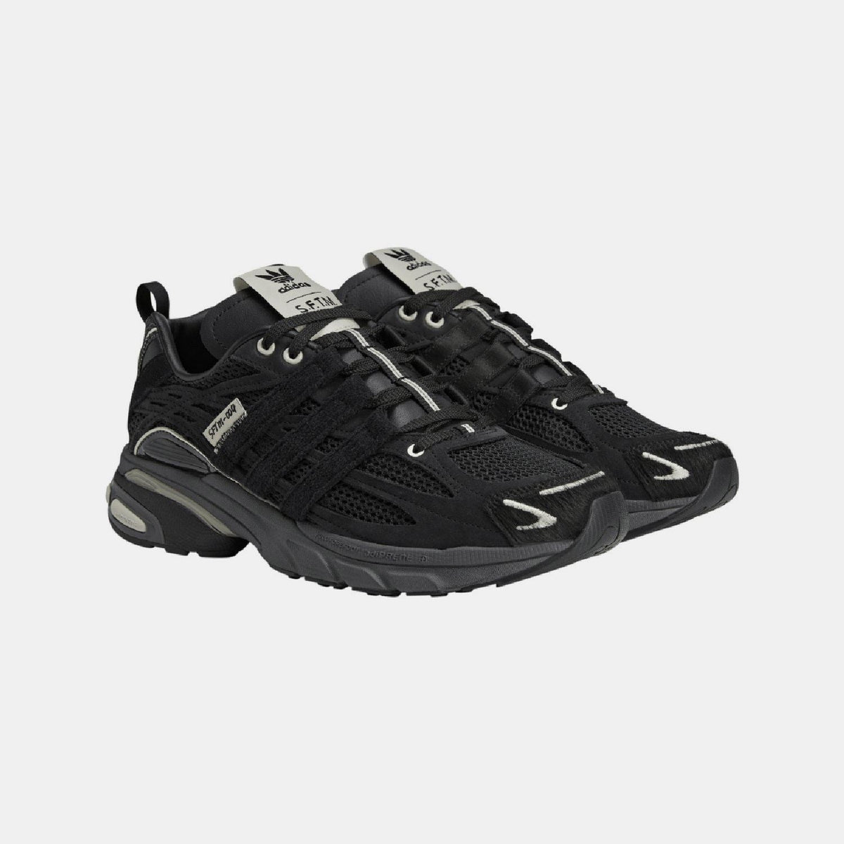 adidas Originals Adistar Cushion STFM trainers, sporty footwear with cushioned soles and stylish design, on a neutral background
