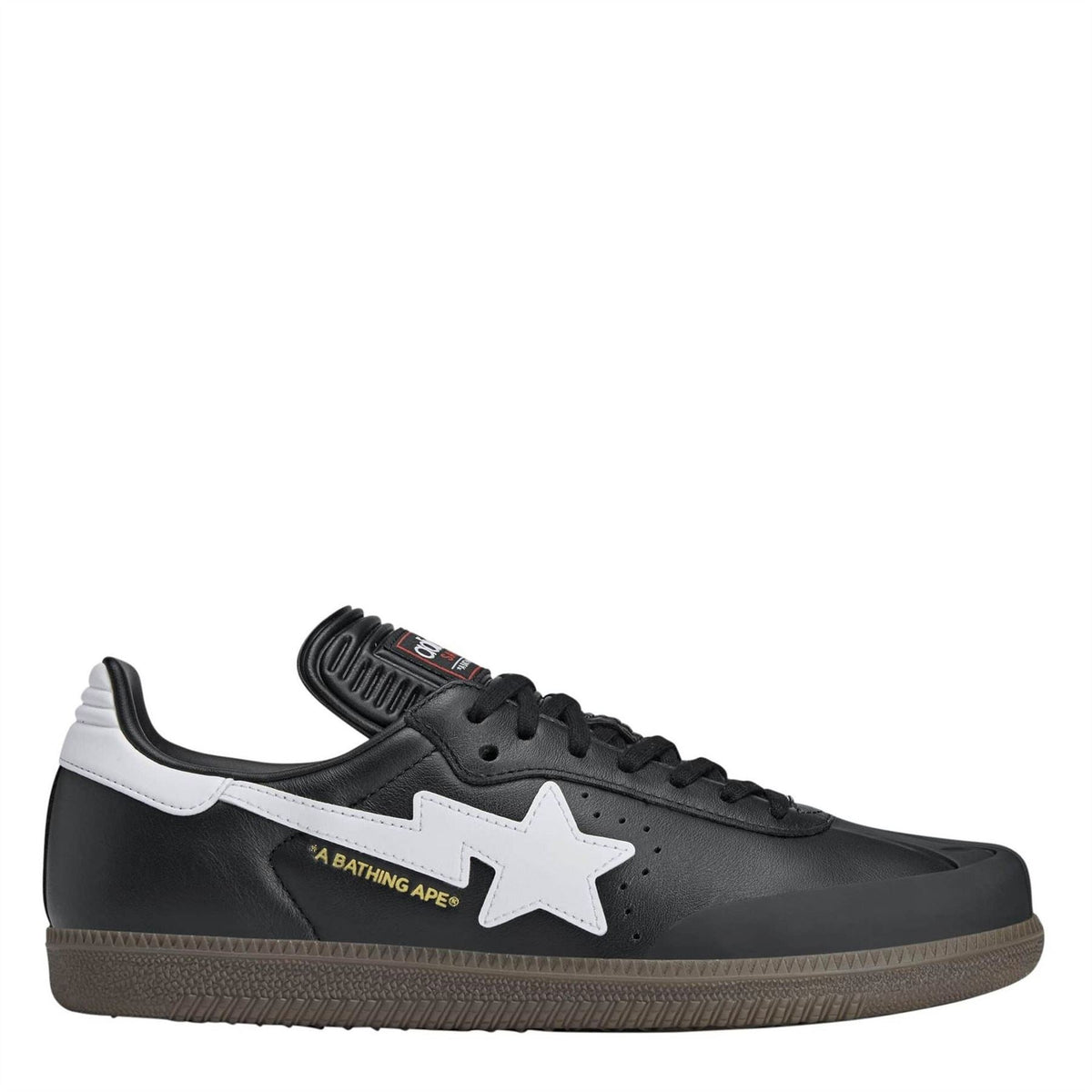 Black low-top canvas sneakers with white star logo and black lace-up design