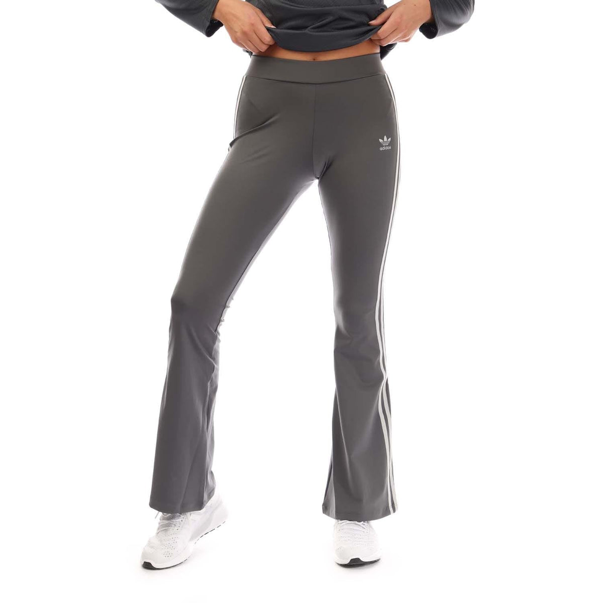 Grey flared leggings with white adidas logo and three side stripes