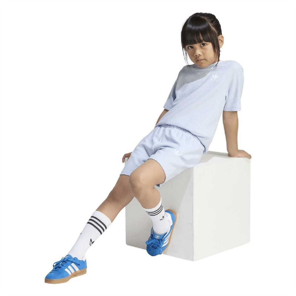 Juniors light blue loose T-shirt and shorts set worn, side view with drawstring shorts.