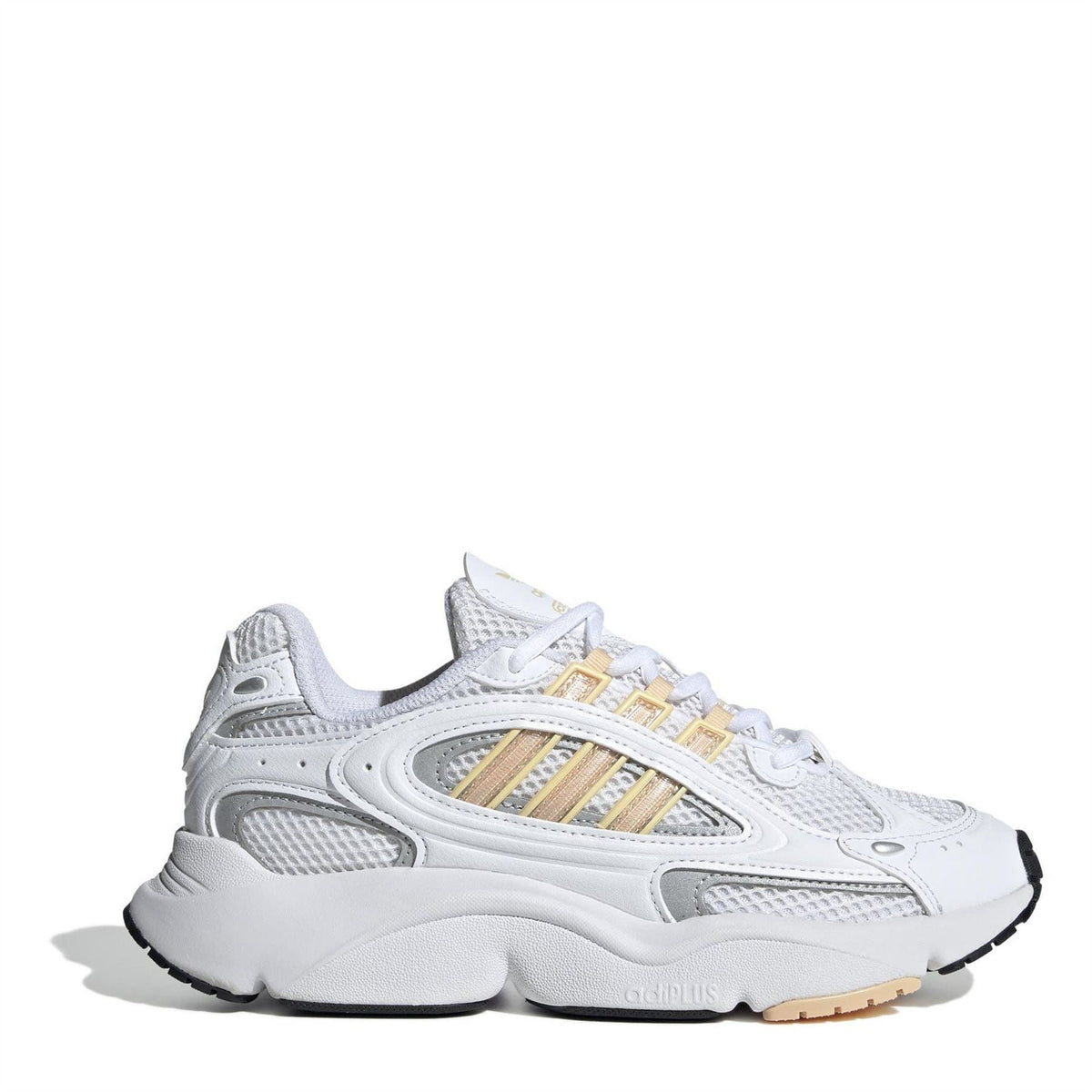 adidas Originals low-top sneakers in white with gold-striped accents and chunky sole
