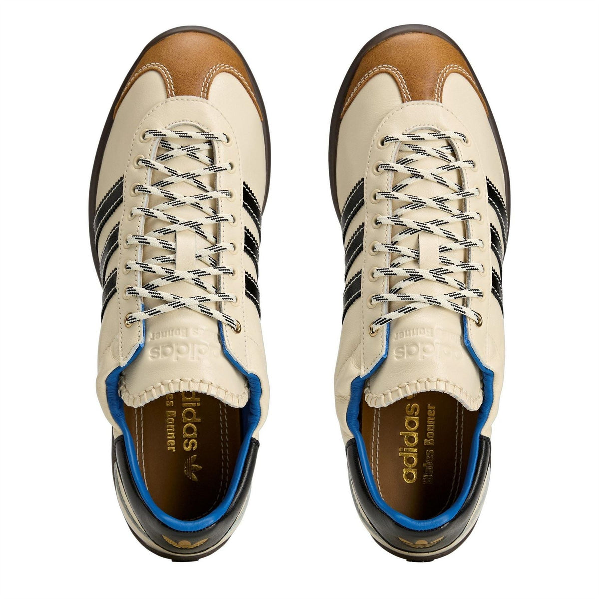 adidas Originals lace-up sneakers with beige uppers, black stripes, and blue inner lining