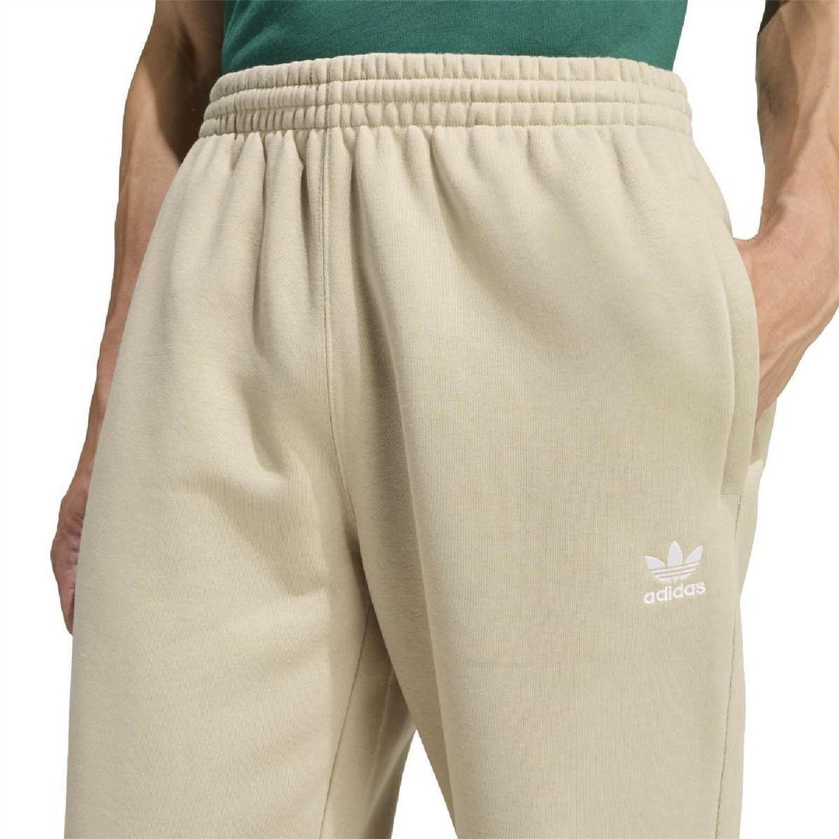 Stone khaki joggers with elastic waistband and Trefoil and adidas logos on thigh