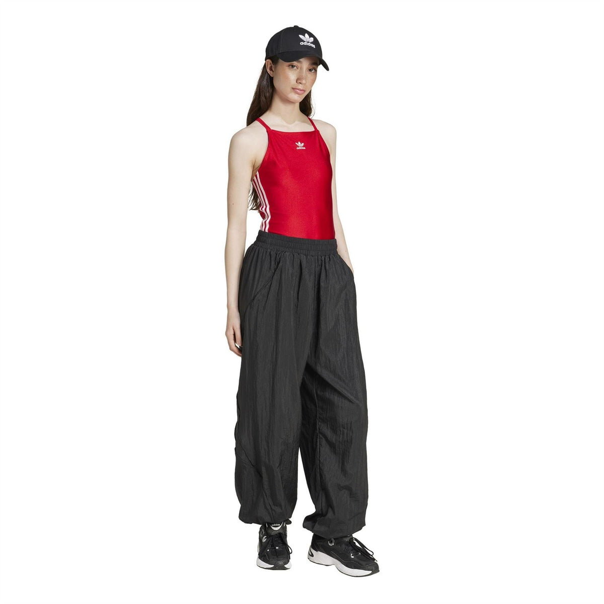 Red adidas Originals bodysuit with side stripe detail, styled with black pants