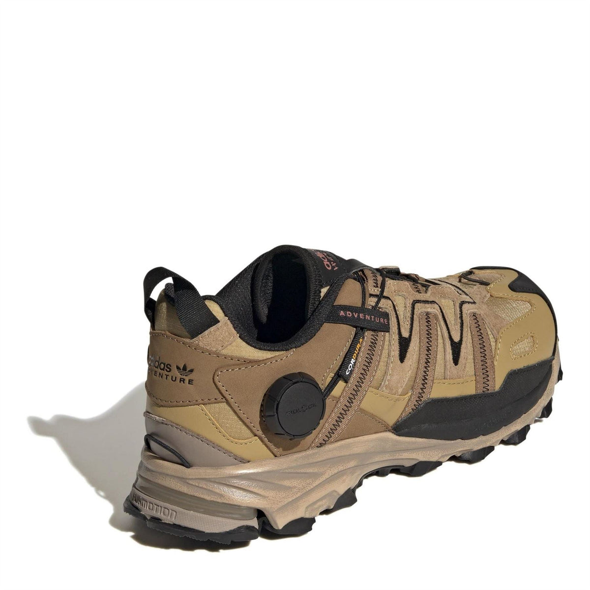 Beige low-top hiking sneaker with black collar, lace-up, and cushioned sole