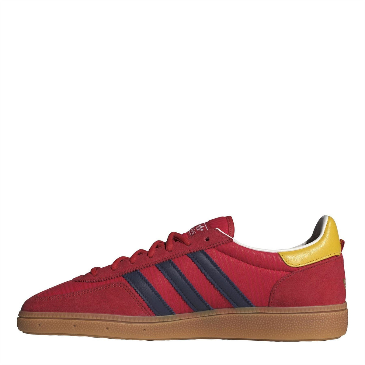 Men's low-top trainers in red with navy triple stripes and yellow heel tab, gum sole